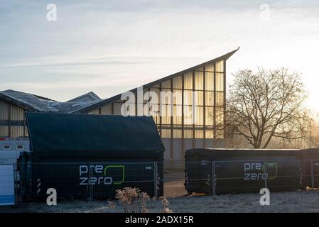 Magdeburg, Germany. 05th Dec, 2019. In front of the hypar shell are containers for environmentally harmful building materials. The listed building has been renovated since this week. Planned total costs: 17 million euros. According to the plan, the work will be completed in the summer of 2022. Credit: Stephan Schulz/dpa-Zentralbild/ZB/dpa/Alamy Live News Stock Photo