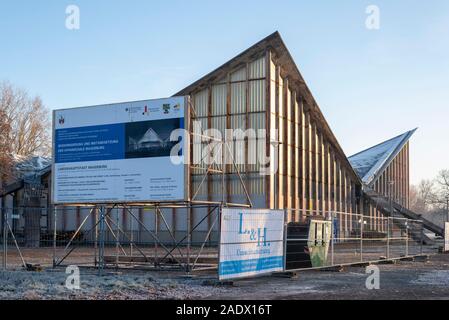 Magdeburg, Germany. 05th Dec, 2019. Signs on building fences around the Hyparschale provide information about the 17 million euro renovation of the listed building. According to the plan, the work will continue until summer 2022. Credit: Stephan Schulz/dpa-Zentralbild/ZB/dpa/Alamy Live News Stock Photo