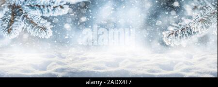 Abstract christmas background winter snowy landscape and fir or pine branches. Winter panoramic banner Stock Photo