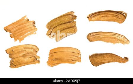 Set of golden color smudges, splashes and strokes. Stock Photo