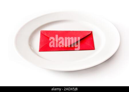 White plate surrounded with paper envelope on white background Stock Photo