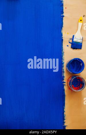 Wall of crumbled blue paint brush texture as background Stock Photo