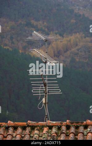 Old TV antenna on a rooftop Stock Photo