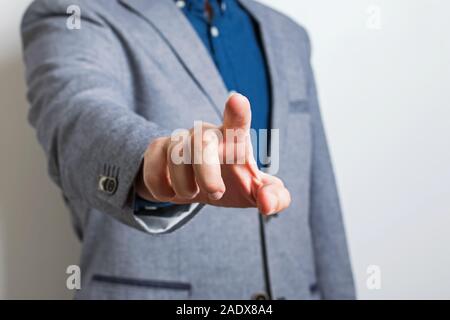 Man in suit pointing with his finger. Stock Photo