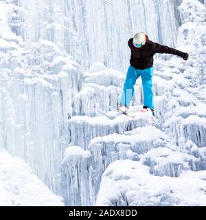 jump with ski from ice waterfall Stock Photo