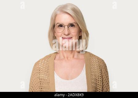 Headshot of mature woman wearing glasses looking at camera Stock Photo