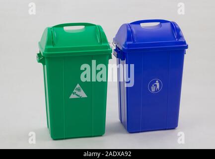Different colored trash bins for collecting various type of garbage isolated on white background Stock Photo