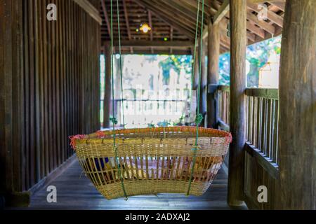 bamboo cradle, or baby siwing in old house from north of Thailand. Stock Photo