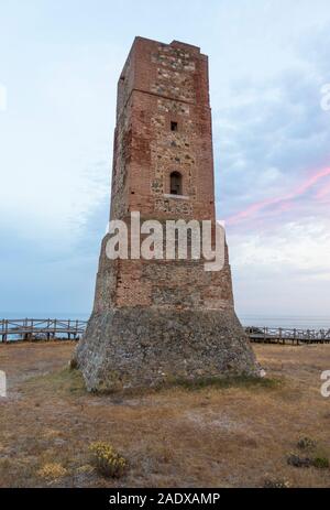 Moorish lookout tower, Thieves Tower, at beach Cabopino near Marbella, at sunset, Andalusia, Spain. Stock Photo