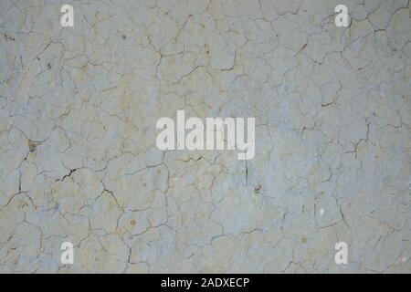 Old cracked wall made from mud and hay, exterior background, grunge texture with cracks for designs Stock Photo