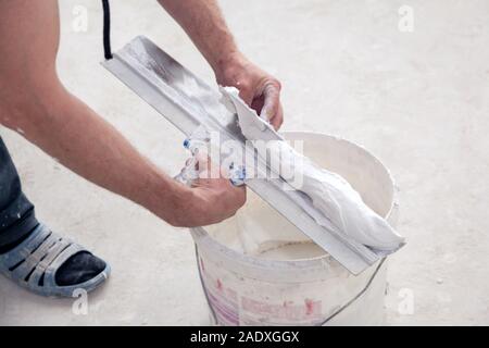 Puttyer Holding Spatula With Putty Solution Indoors Construction