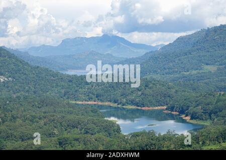 Mountain landscape in a green valley with the villages. View of Kotmale Reservoir, Sri Lanka. Stock Photo