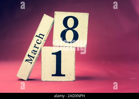March 18th, Eighteenth of March, Day 18 of month March - vintage wooden calendar blocks on maroon background with empty space for text Stock Photo