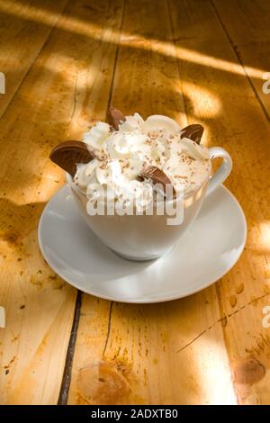 Hot chocolate drink with cream and chocolate orange segments Stock Photo