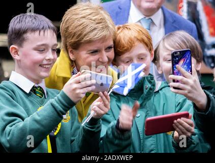SNP leader Nicola Sturgeon has selfies taken with pupils from St Dominic's RC Primary School at the Nutcracker Christmas Village shop during a visit to Crieff Visitors Centre, Crieff, on the General Election campaign trail. Stock Photo