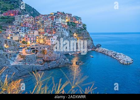 Spectacular view on Manarola at twilight, Cinque Terre in Italy Stock Photo