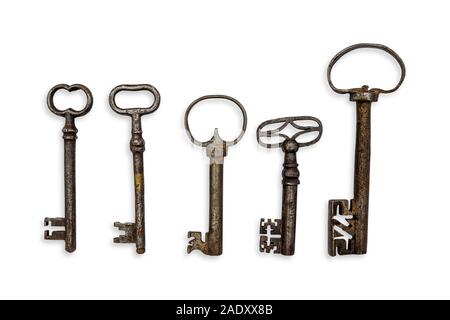 five antique iron keys isolated on white background Stock Photo