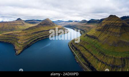 Aerial panorama of spectacular fjords near the village of Funningur photographed from the Hvithamar mountain in Faroe Islands, Denmark. Stock Photo