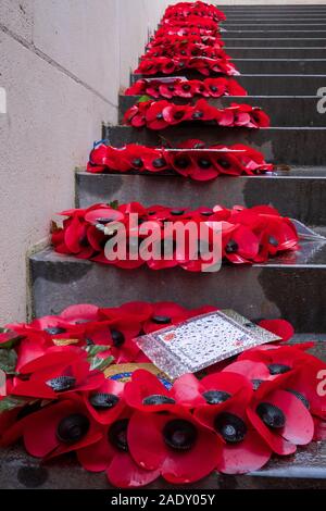 Poppy wreaths laid on steps inside Menin Gate, Ypres Stock Photo