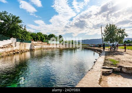 Shahrtuz Shahritus Chiluchor Chashma Springs Picturesque Breathtaking View of River and Children on a Sunny Blue Sky Day Stock Photo