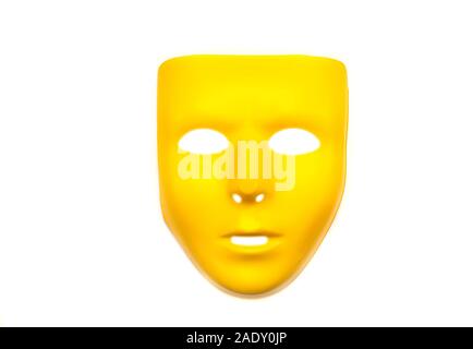 Yellow plastic Face Mask, Mask for Carnival, Face of Anonymous isolated on white Background Stock Photo