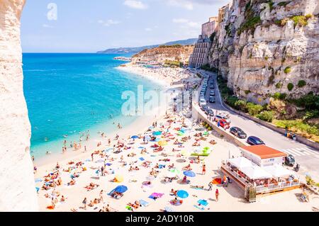 Tropea, Calabria, Italy - September 07, 2019: Rotonda beach full of people. Amazing Italian beaches. Sea promenade scenery in Tropea with high cliffs Stock Photo