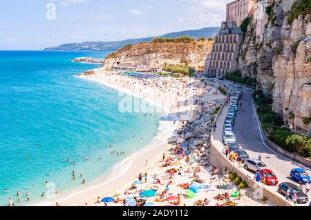 Tropea, Calabria, Italy - September 07, 2019: Rotonda beach full of people. Amazing Italian beaches. Sea promenade scenery in Tropea with high cliffs Stock Photo