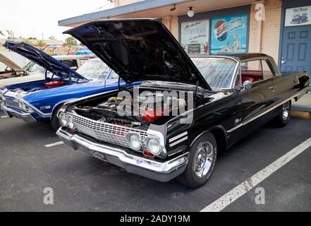 hoods open and engines on display of classic cars in classic car rally old town kissimmee florida usa Stock Photo