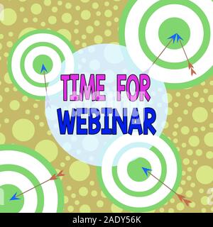 Text sign showing Time For Webinar. Business photo text seminar conducted over the Internet Web conferencing Arrow and round target inside asymmetrica Stock Photo