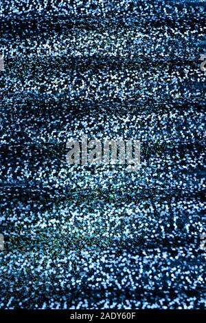 Photo of holographic real texture in blue colors, magic iridescent surface. Holographic blue color wrinkled foil. Stock Photo