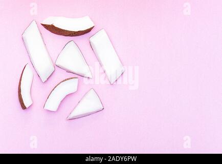Coconut Pieces, Cut Coconut isolated on colored Background Stock Photo