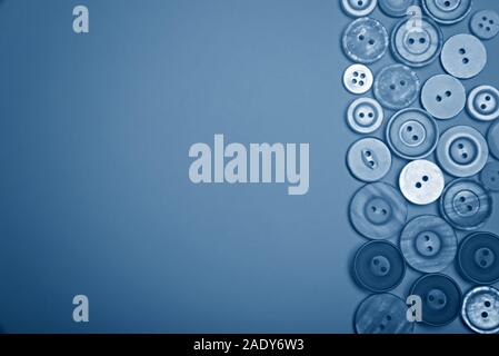 Buttons of different colors in blue tones. Flat lay. Stock Photo