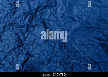High detailed abstract crumpled packaging paper texture, background for your design in blue color. Stock Photo