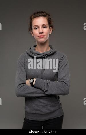 Sport caucasian woman, picture isolated on grey background. Stock Photo