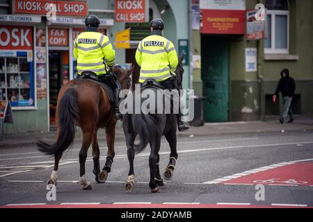 Hanover, Germany. 26th Nov, 2019. Two policemen ride their service horses through the city centre. Credit: Sina Schuldt/dpa/Alamy Live News Stock Photo