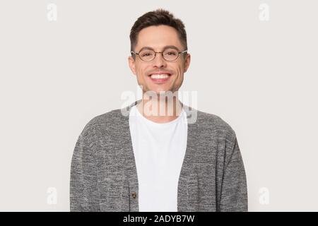 Head shot of smiling millennial man looking at camera Stock Photo