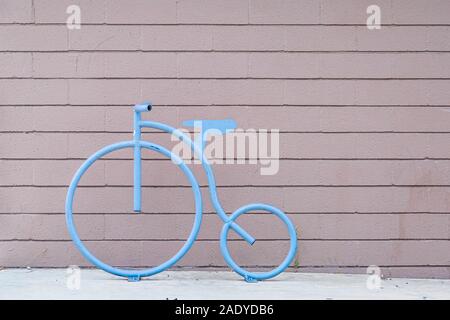 Blue Bicycle Design on Plank Wall Stock Photo