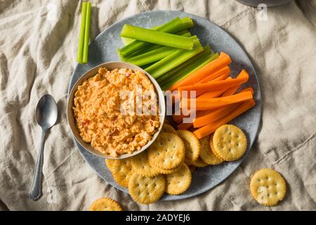 Homemade Pimento Cheese Spread with Crackers and Veggies Stock Photo
