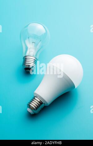 Energy saving and classic light bulbs on colorful background. Stock Photo