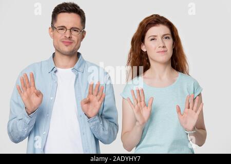 Young family couple refusing bad deal offer. Stock Photo