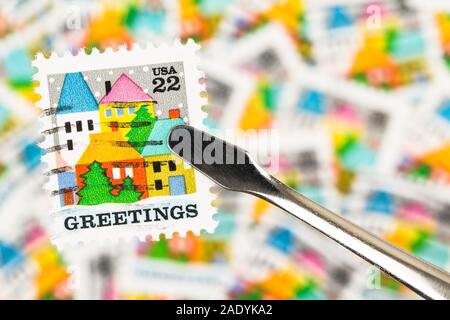 SEATTLE WASHINGTON - November 28, 2019:  Selective focus on Christmas stamp with blurred postage background.  Scott # 2245 issued in 1986 in US. Stock Photo