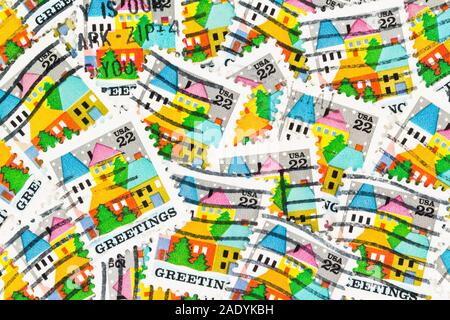 SEATTLE WASHINGTON - November 28, 2019: Scattered Christmas postage stamps background. Scott # 2245 issued in 1986 in United States. Stock Photo