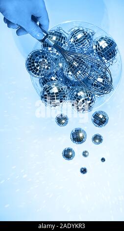 Blue color 2020 inscription. Creative pattern made of silver disco balls for decoration party on pastel blue gradient background. Winter New Years Party holiday concept. top view, flat lay close up. Stock Photo