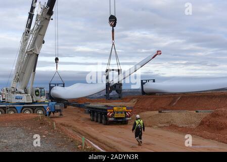 Madrid, Spain. 5th Dec, 2019. Mechanical cranes lift the blade of a wind turbine near the small village of Beltejar.Construction work continues on a new wind farm in Beltejar, north of Spain. Spain is the fifth country in the world to install wind power, after China, USA Germany and India. During COP25, the Spanish president Pedro Sanchez pledged to reduce the level of CO2 emissions by 20% in the next years. Credit: John Milner/SOPA Images/ZUMA Wire/Alamy Live News Stock Photo