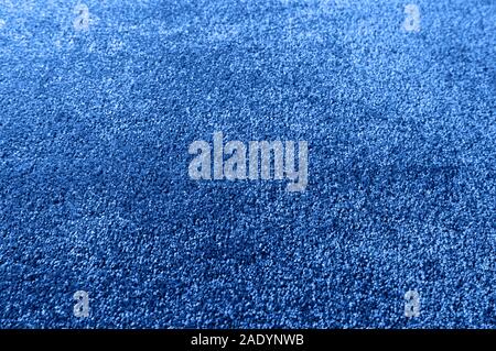 Classic blue carpet texture close up, indoors interior design, color trend of 2020 Stock Photo