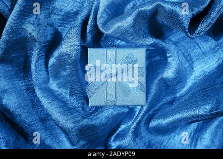Blue color 2020 inscription. Blue silk textures. Gift concept. Stock Photo
