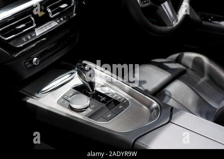 Luxury of car interior at transmission shift gear area. Modern car interior, gearstick radio and air conditioner. Stock Photo