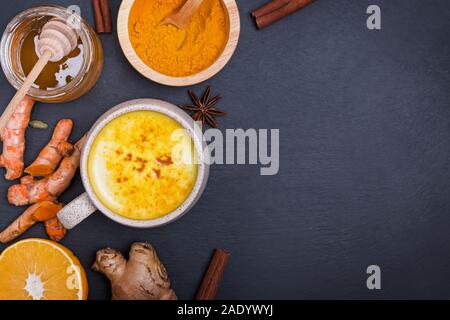 Healthy drink golden turmeric latte in a mug. Stock Photo