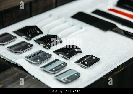 Close up of hair clipper blades on the white towel Stock Photo