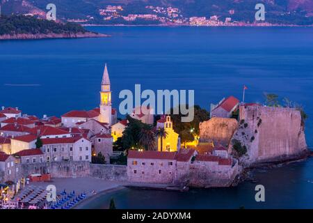 Aerial night view of Saint Ivan and Holy Trinity churches in Old Town of Montenegrin town Budva on the Adriatic Sea, Montenegro Stock Photo